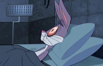 Bugs Bunny lying awake in bed, unable to sleep
